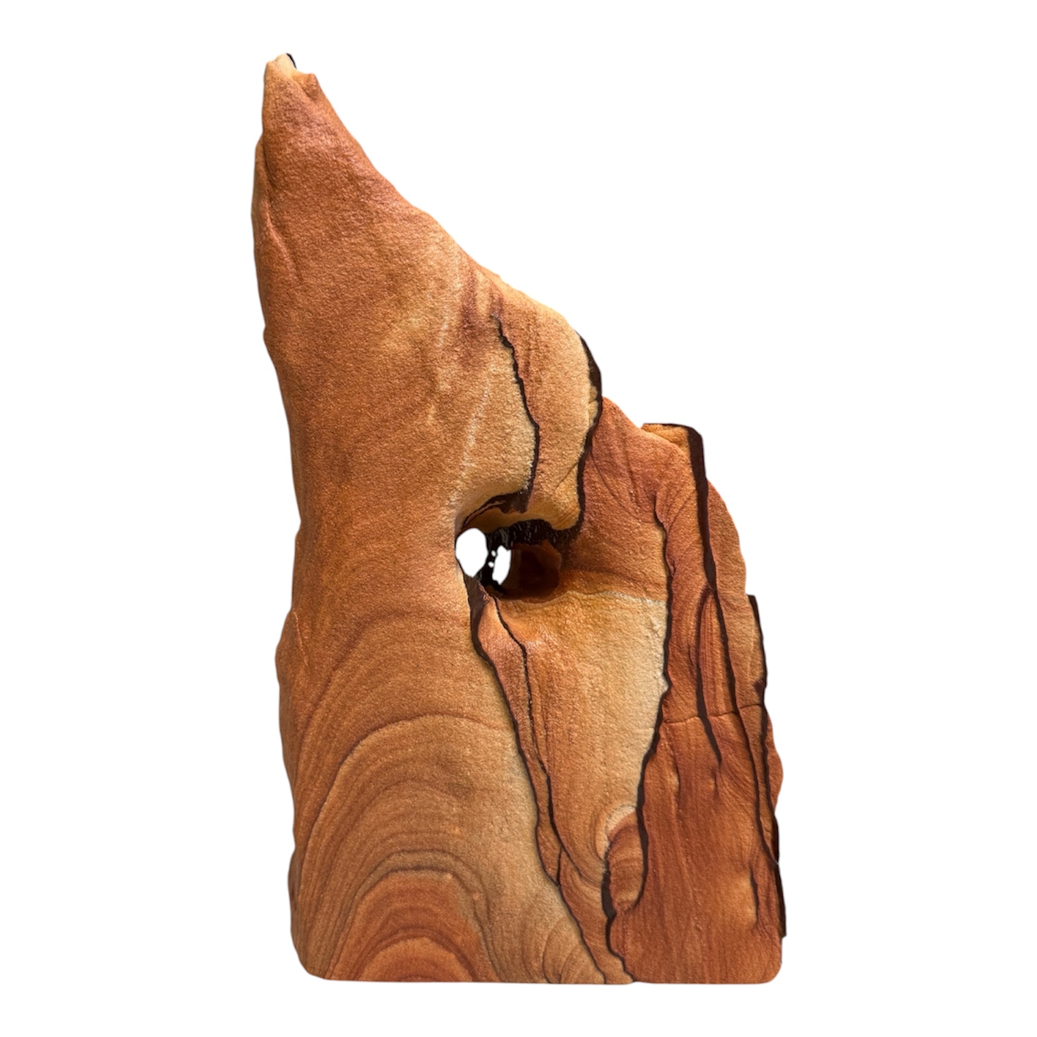 Sculptural sandstone piece with natural banding and an opening