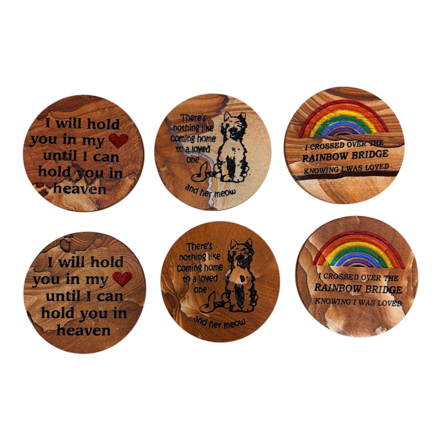 Six engraved stone coasters featuring pet artwork, remembrance messages, hearts, and colorful rainbows